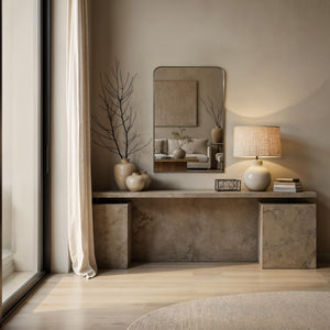 Jackline mirror styled in a modern living room, reflecting a cozy space with neutral decor.