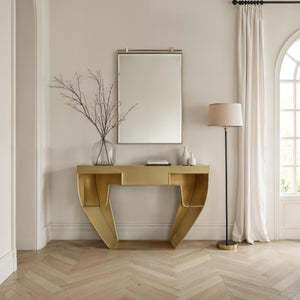 Neem mirror by Renwil displayed above a gold console table in a modern interior setting.