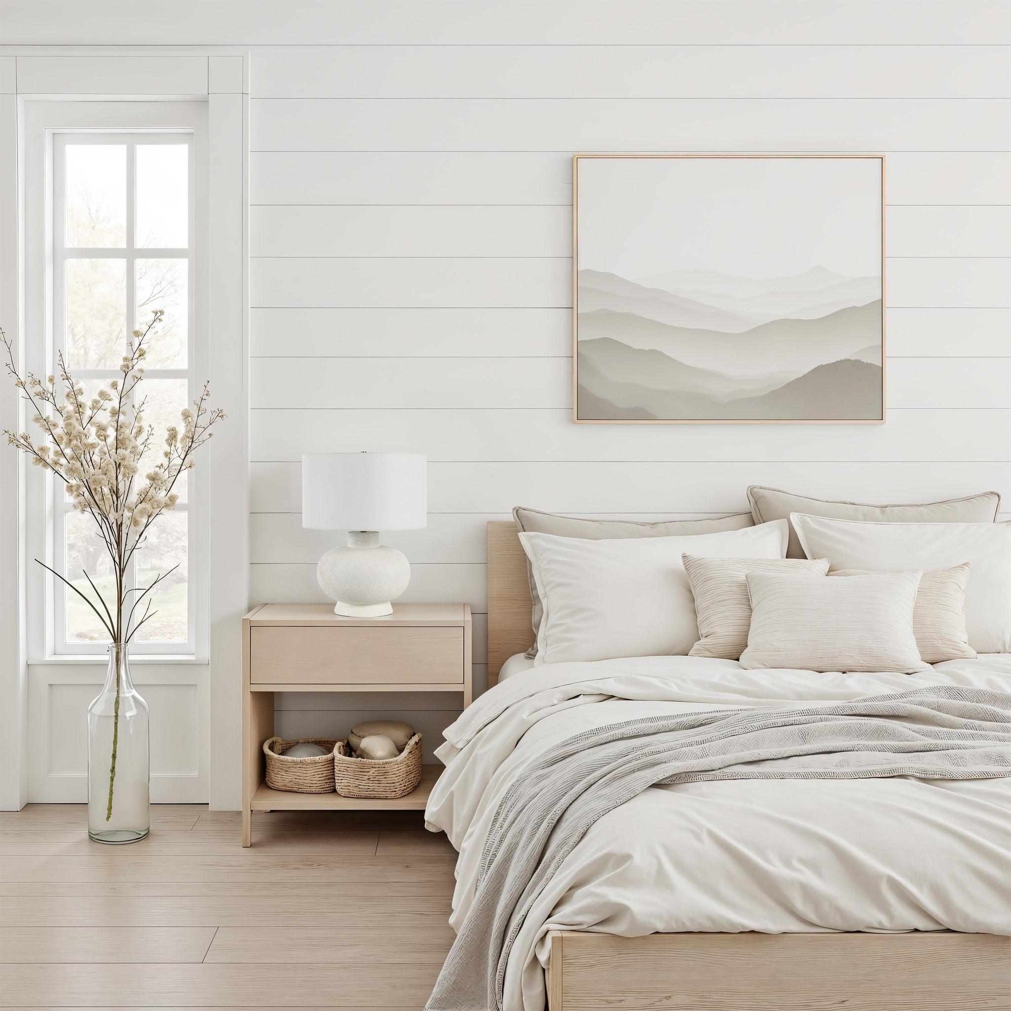 Mallow Table Lamp by Renwil on a nightstand in a cozy bedroom setting with neutral decor.