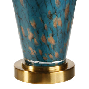 Close-up of Milo Table Lamp's teal ceramic base with gold flecks and a gold circular base.