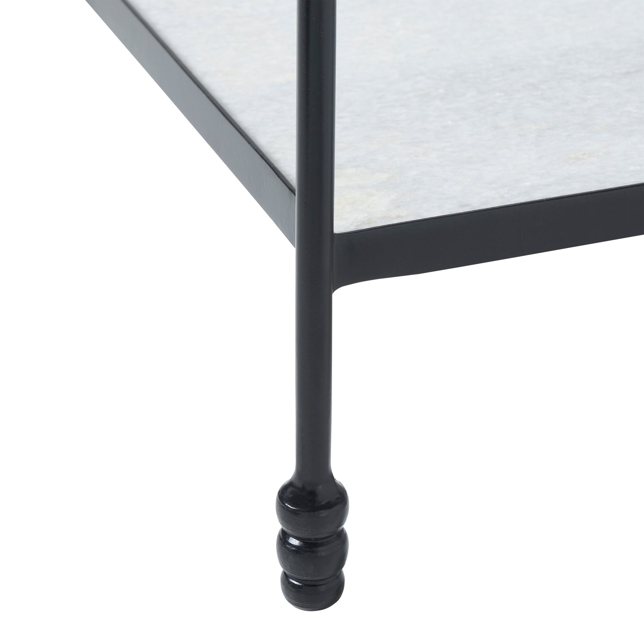 Giulia table featuring a black metal leg and light gray stone shelf, viewed from the side.