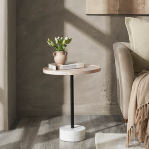Antares Side Table styled with a vase and book, set beside a beige sofa in a cozy interior.