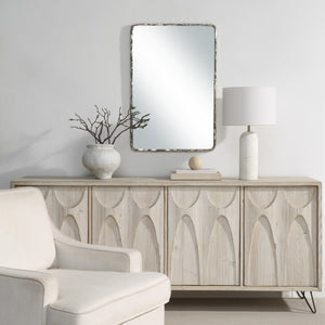 Pollonia mirror by Renwil displayed above a wooden console in a modern living room