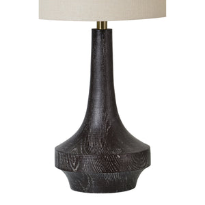 Truro Table Lamp showcasing a sleek black wood base and a light beige shade, angled view.