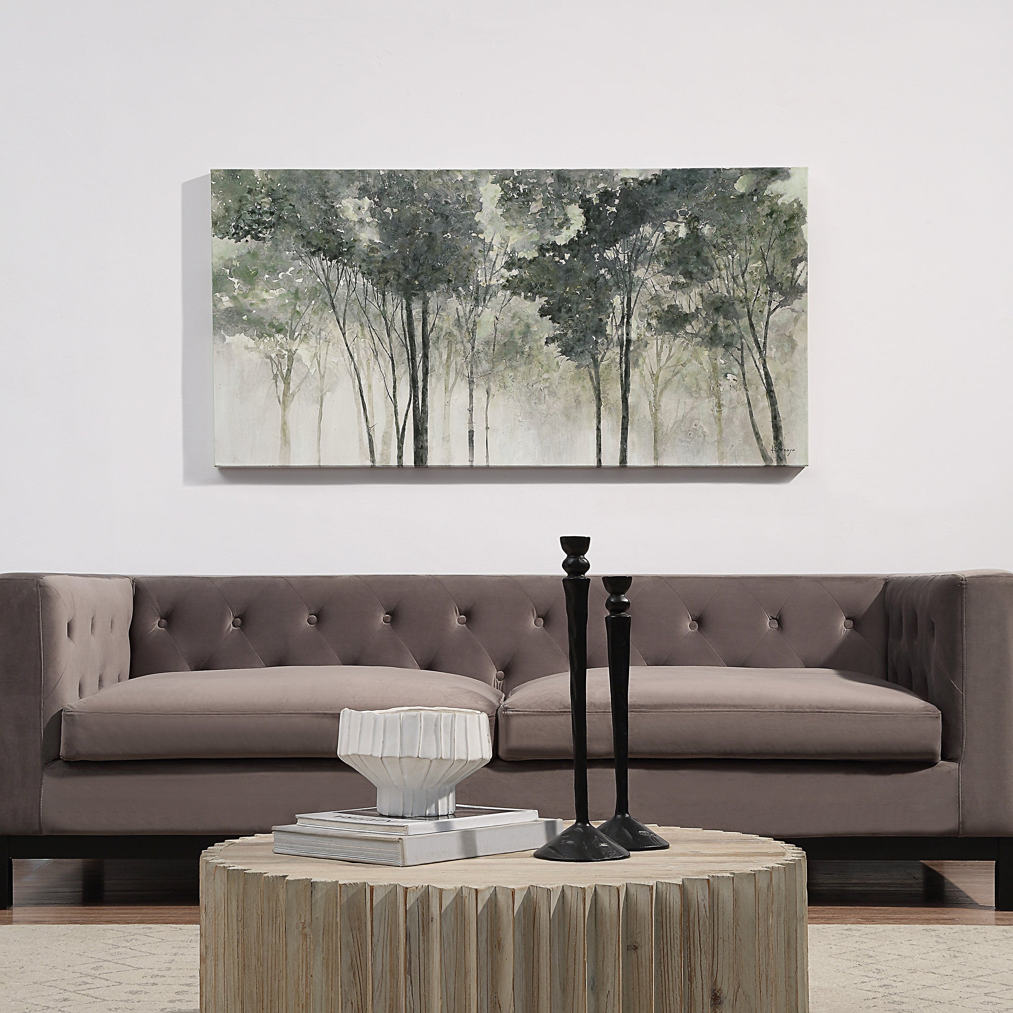 Potter canvas art displayed above a modern sofa in a stylish living room