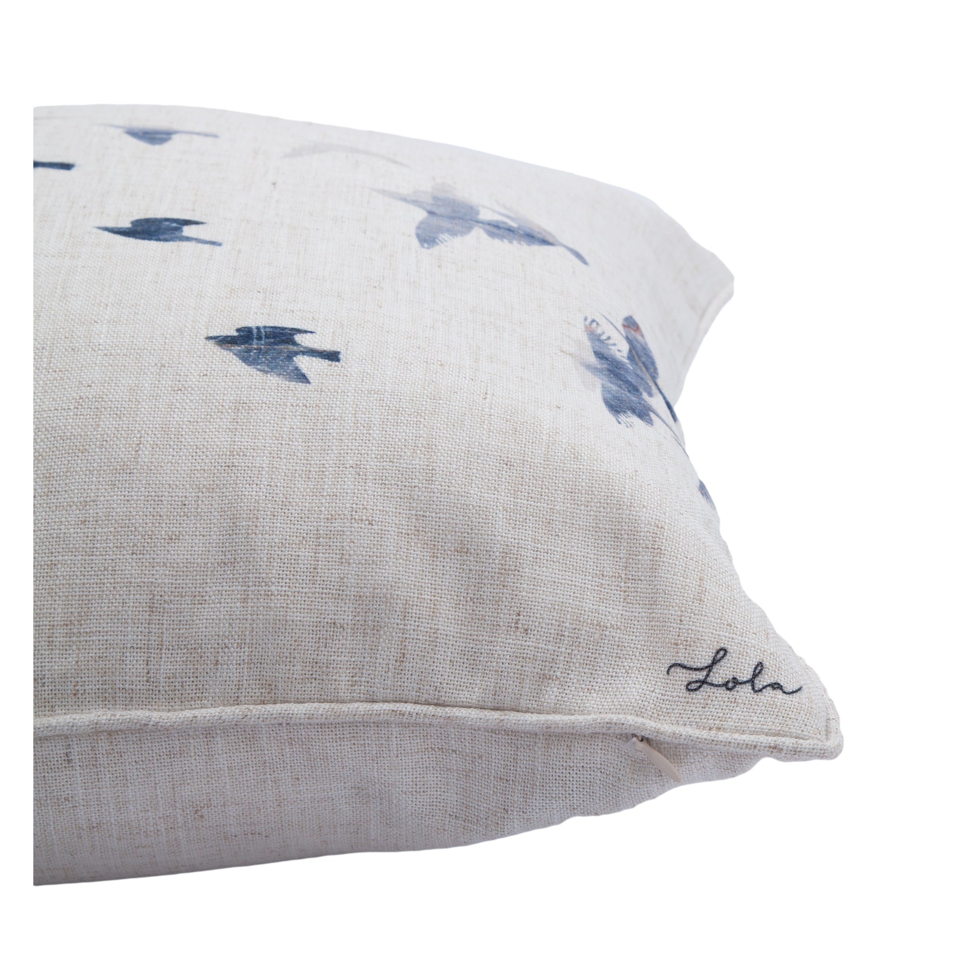 Close-up of Flight indoor pillow showing bird print and edge detail.