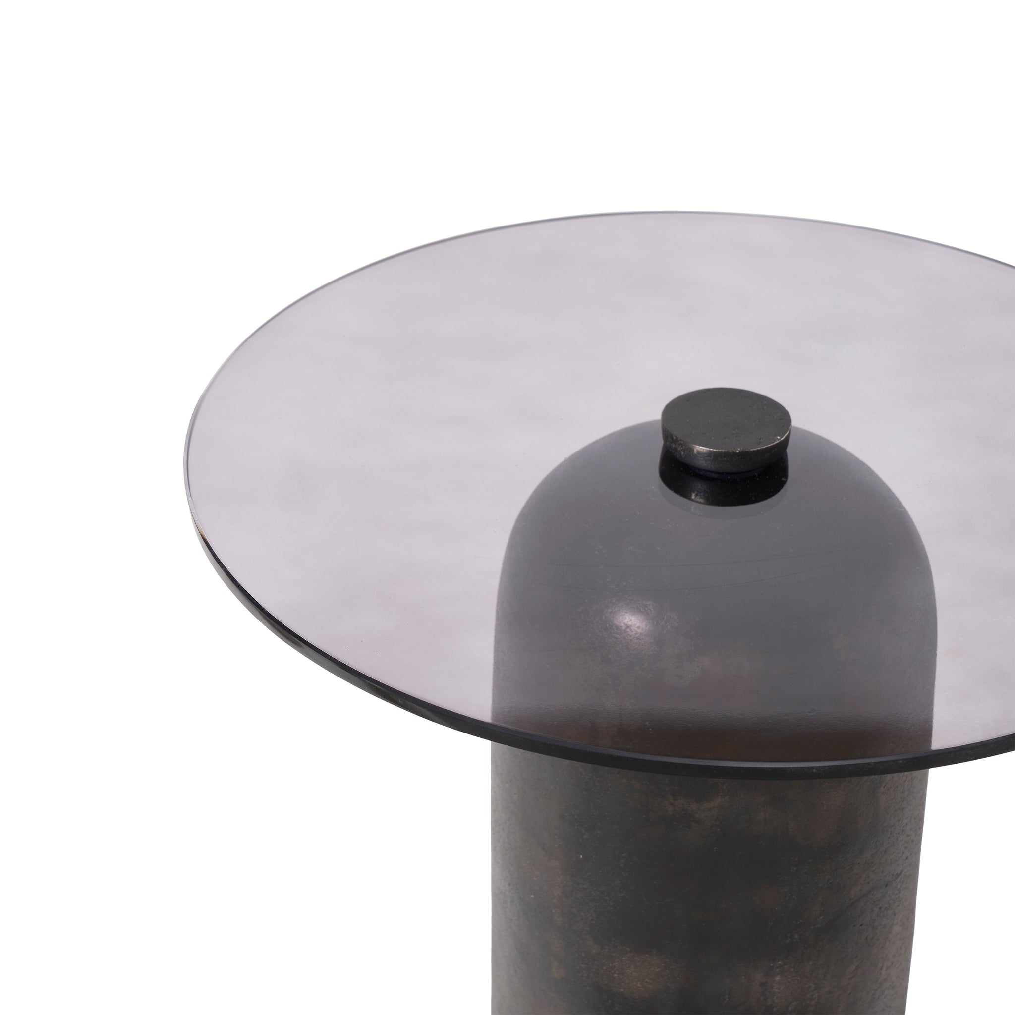 Top view of the Arta accent table, highlighting the round smoky glass top and central knob.