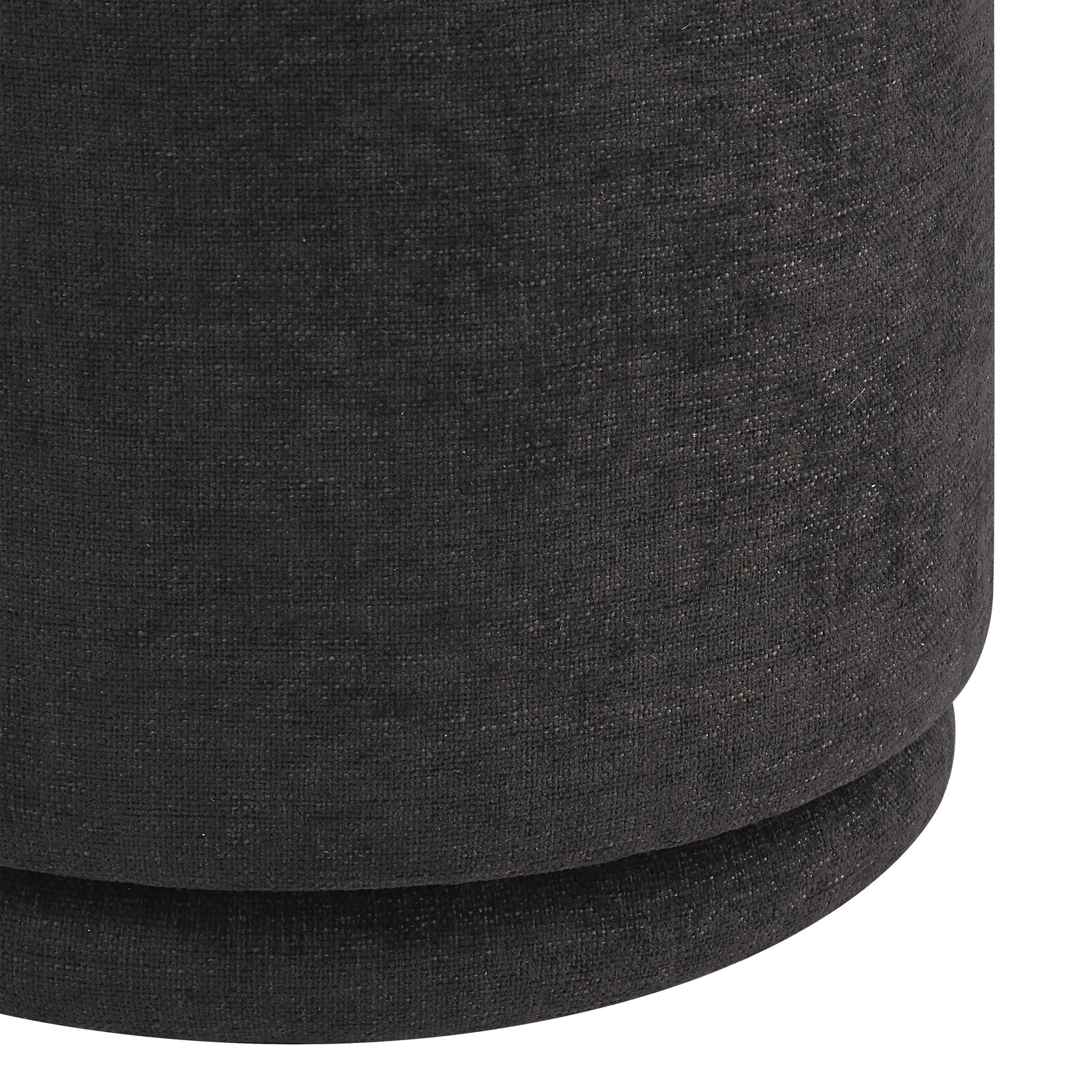 Hevea stool in dark gray fabric, round shape with a smooth top and base.