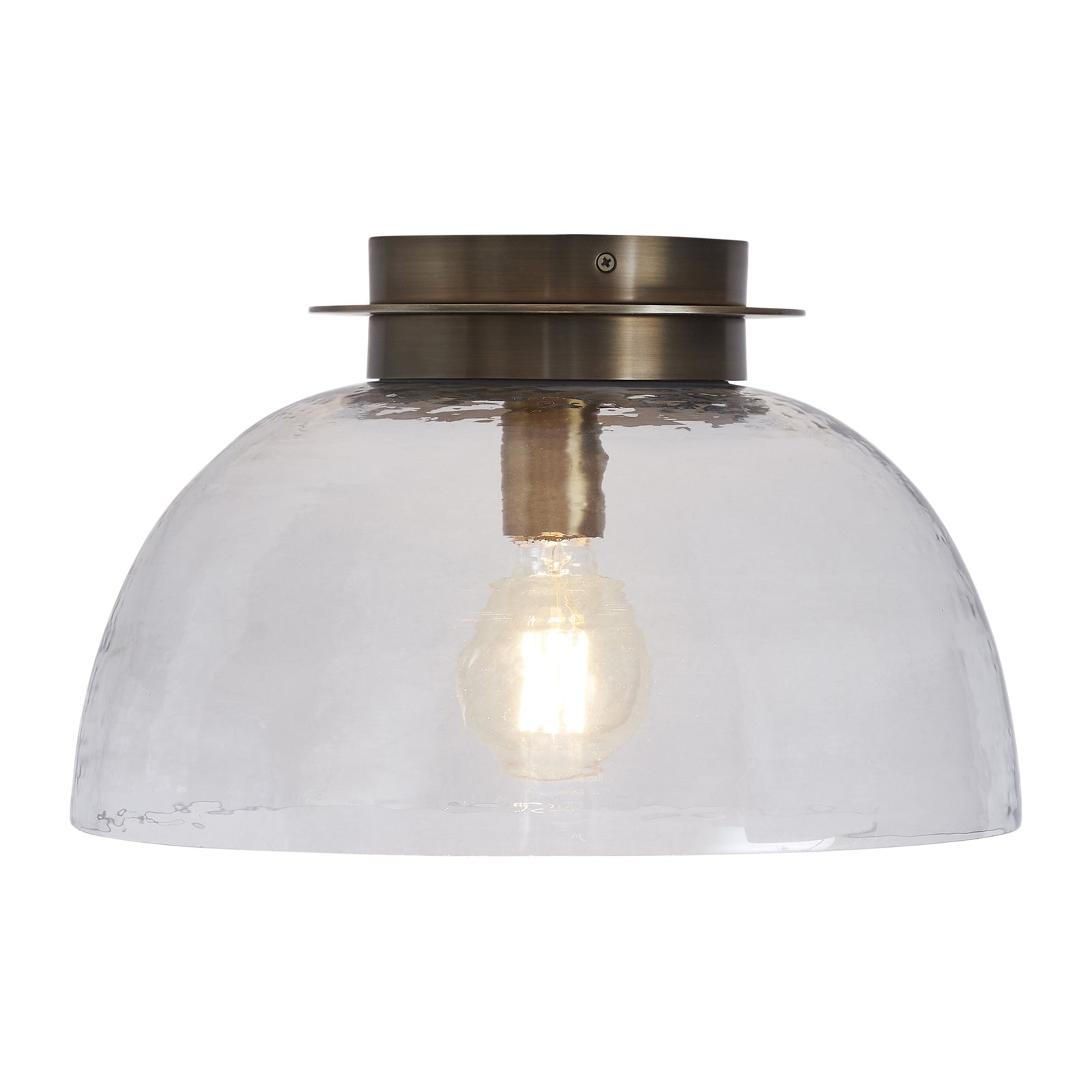 Liliane Flush Mount light with a clear glass dome and brass fixture, top view.