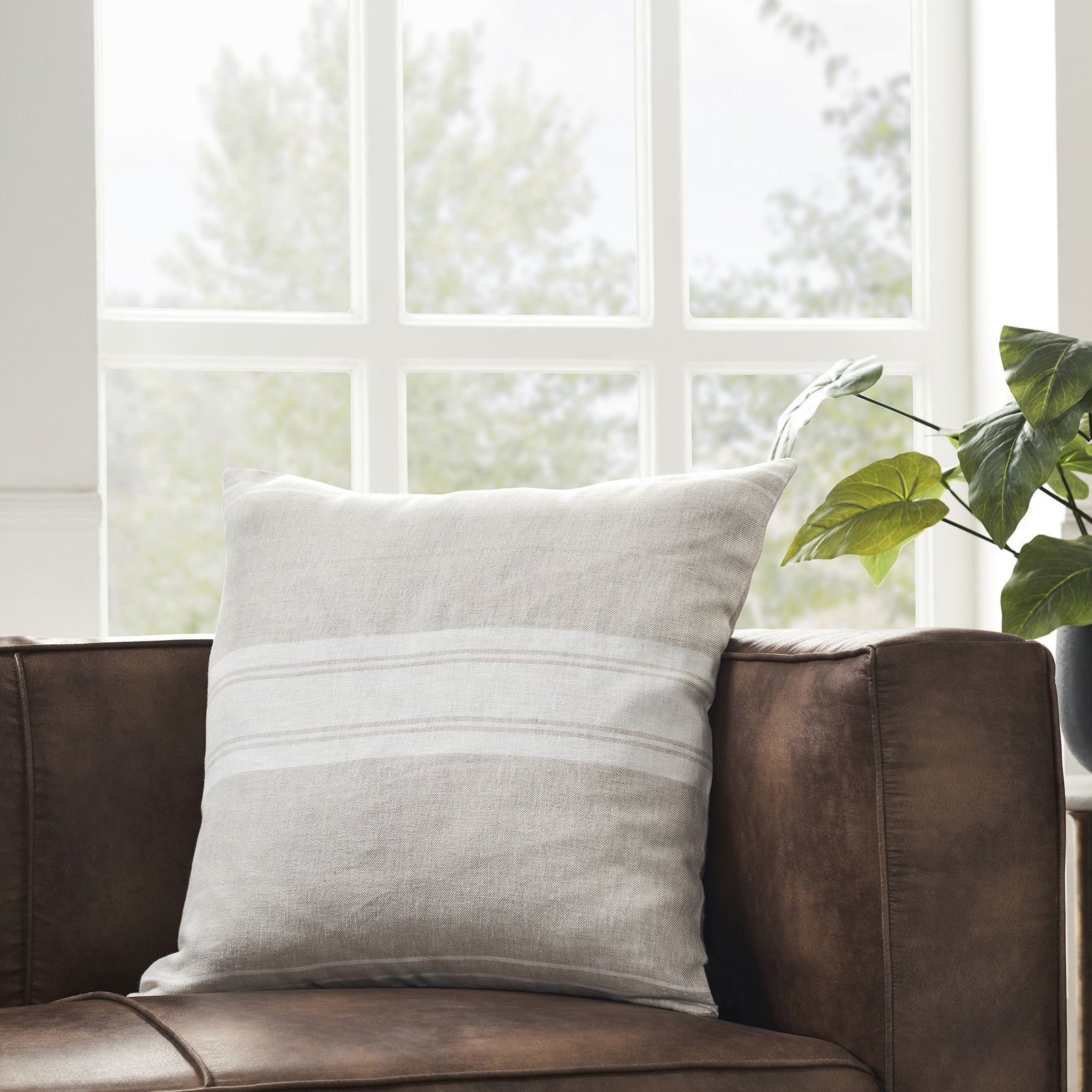 Raelyn Indoor Pillow in light gray with white stripes, showcasing a textured linen fabric.