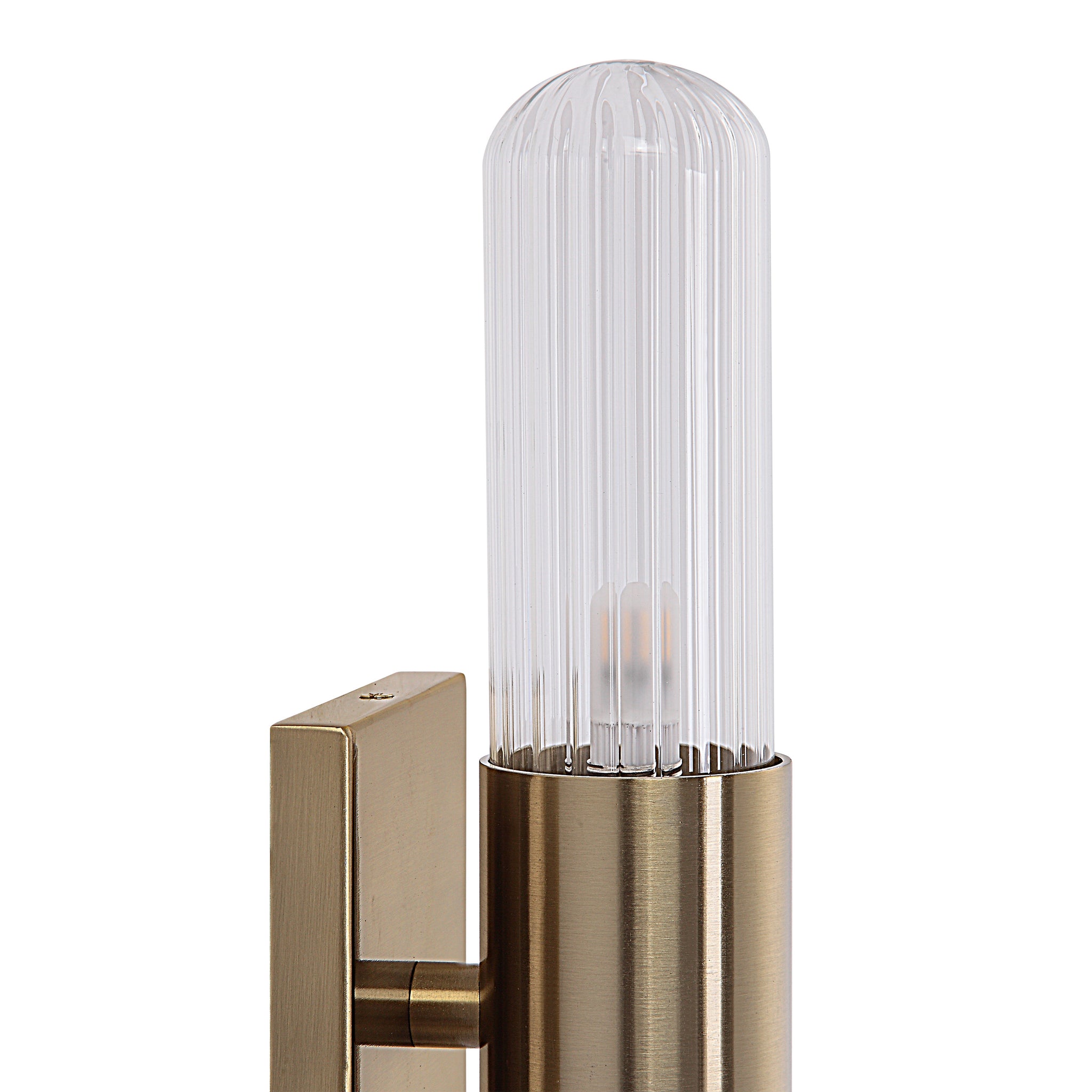 Chiara Wall Sconce featuring a ribbed glass shade and brass finish, close-up view