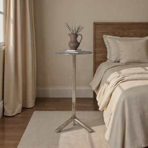 Zahra side table styled in a bedroom with a vase and books on top