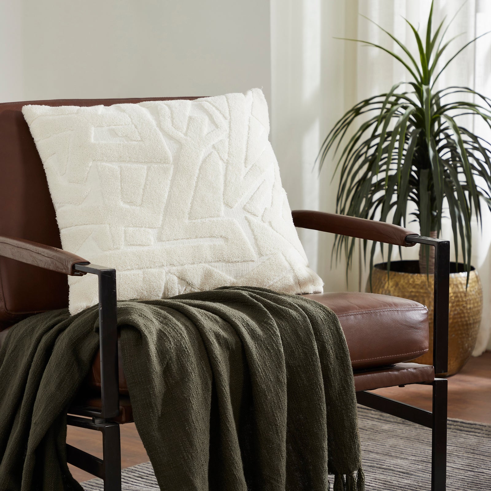 Merano indoor pillow in white with textured abstract pattern