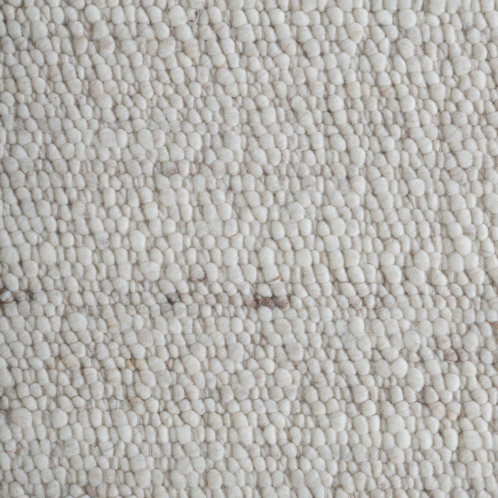 Meghan rug in light beige with a textured woven pattern, rectangular shape, flat view.