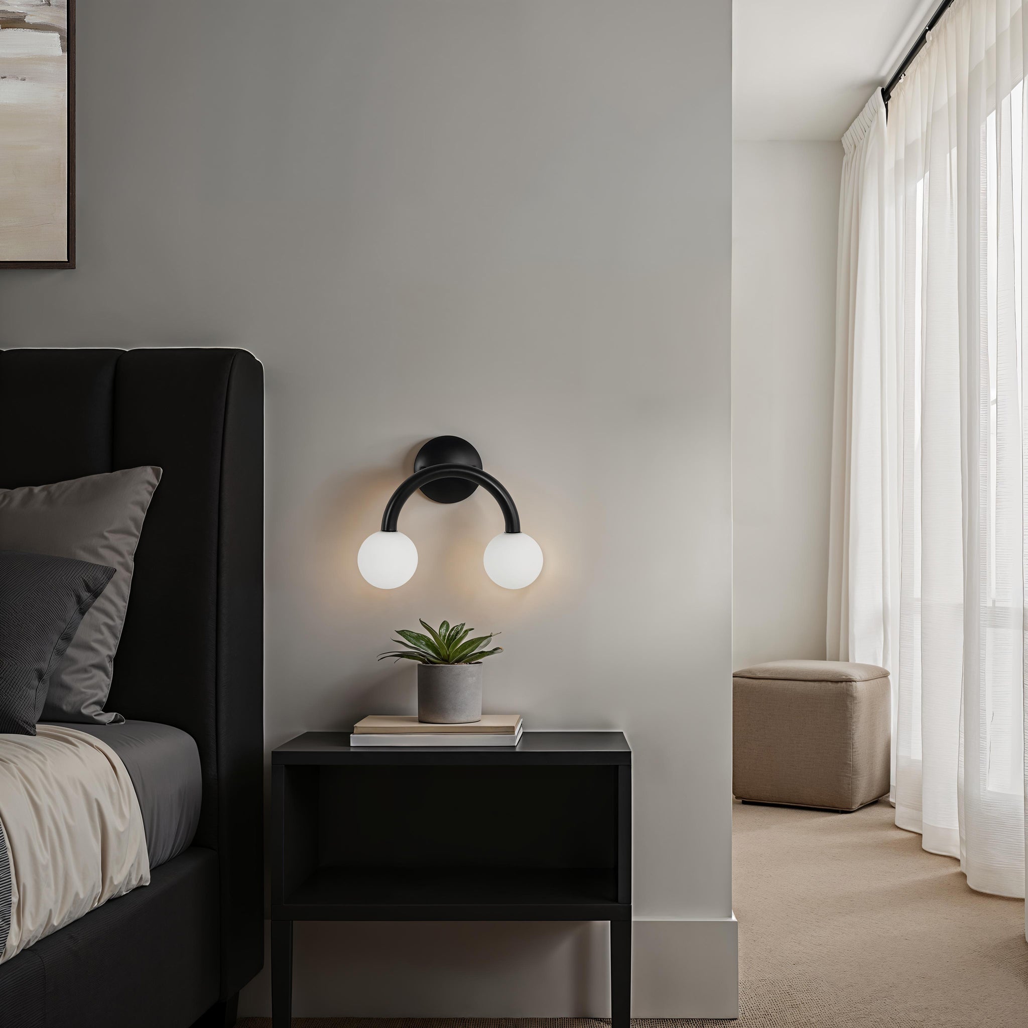 Santo wall sconce in a bedroom setting beside a bed and plant