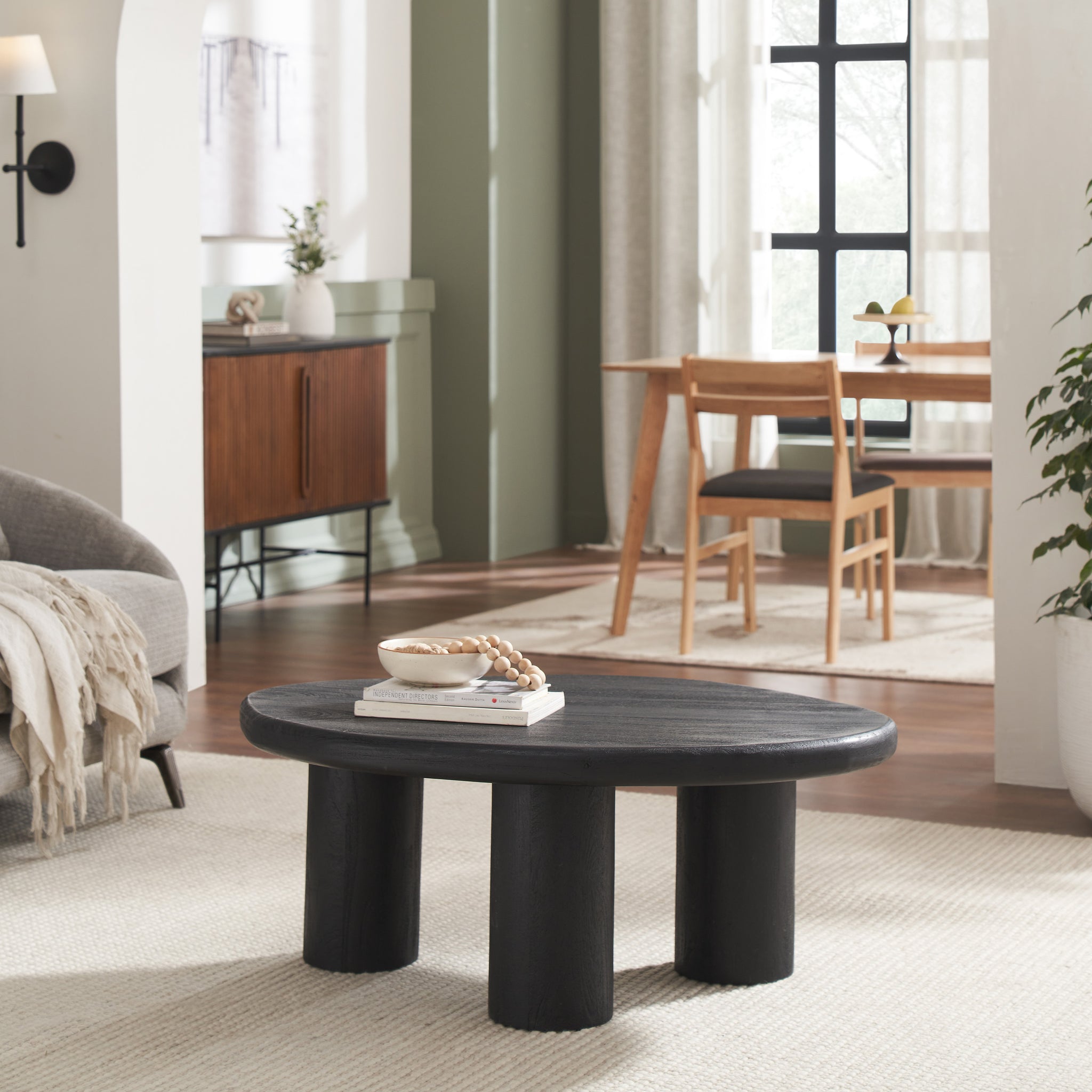 Rowe table in a living room setting with a bowl and books on top