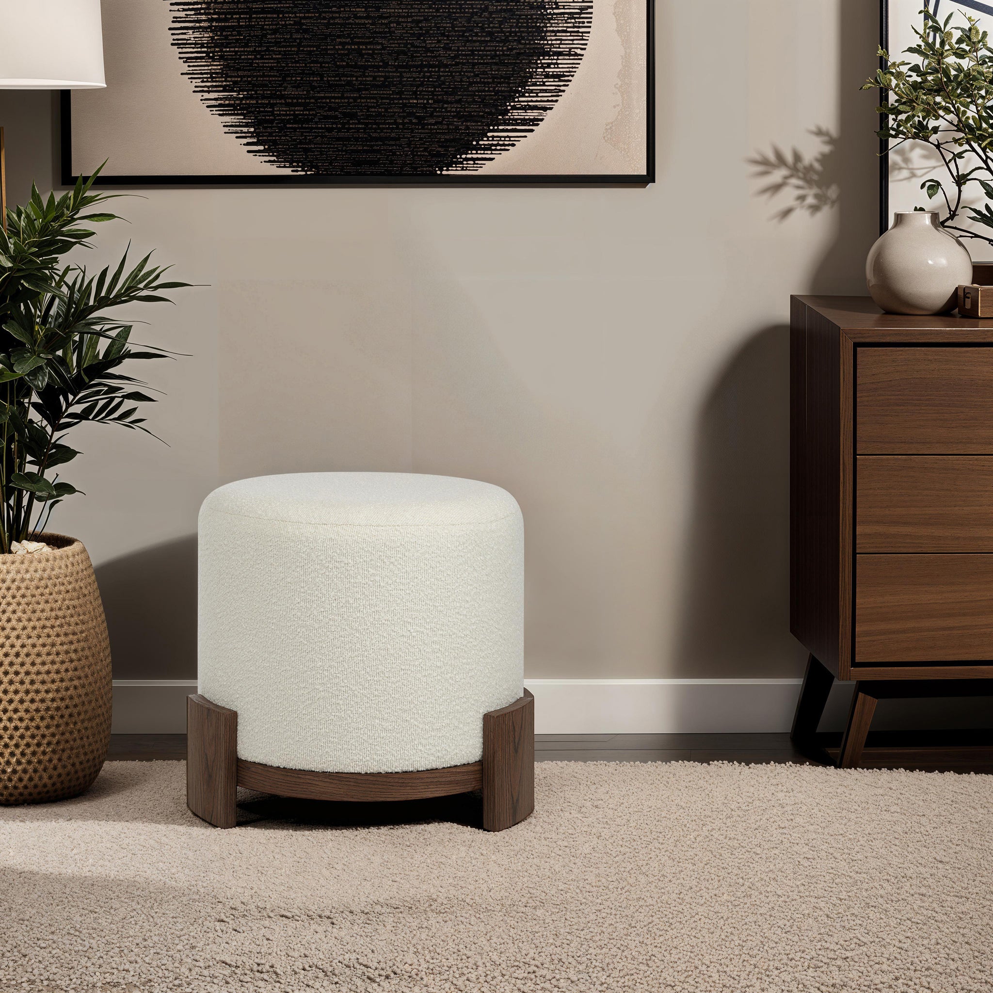 Chaves Ottoman by Renwil, placed next to a modern cabinet, cream upholstery and wood legs