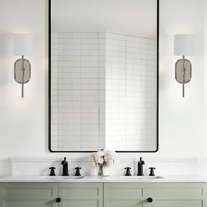 Whitney wall sconces installed in a modern bathroom with a large mirror