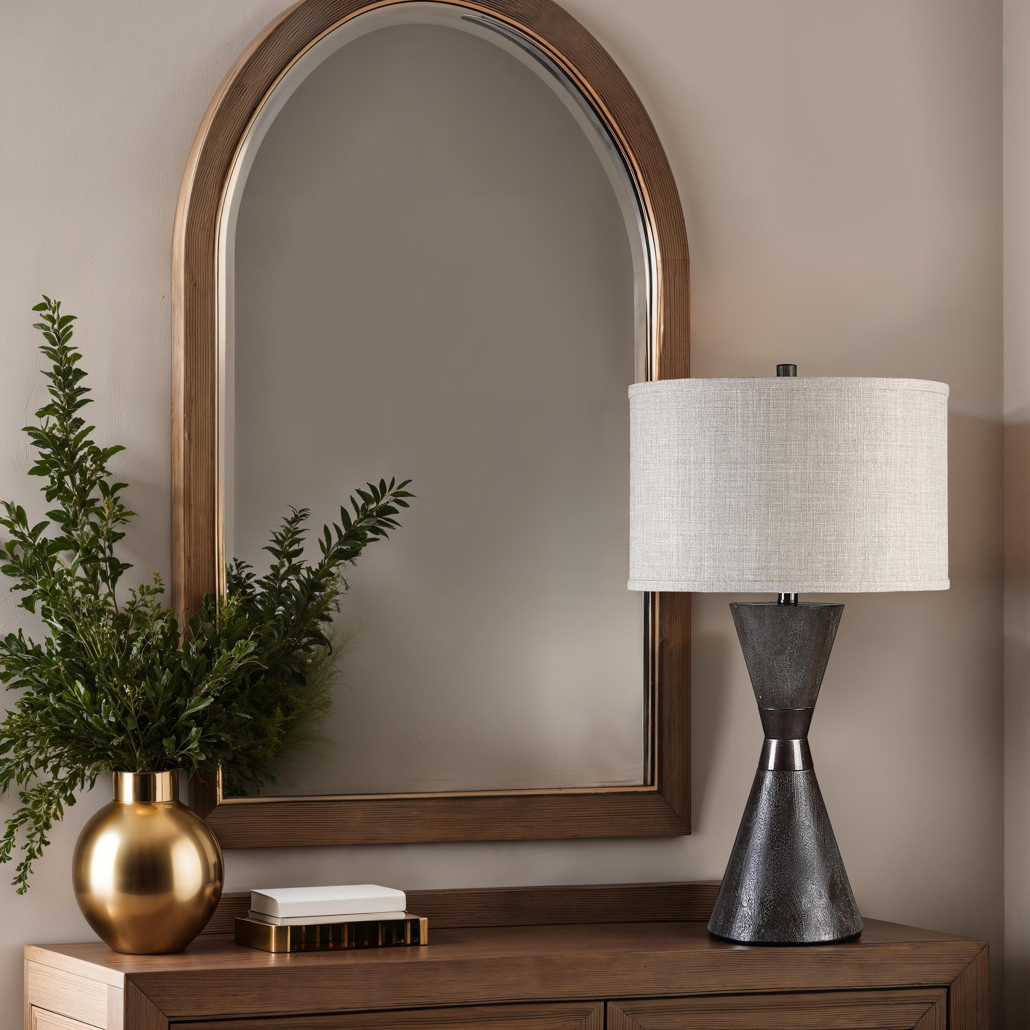 Vyara table lamp on a wooden console with a mirror and greenery