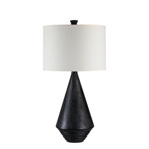 Tortora Table Lamp with a black textured base and white fabric shade, side view.
