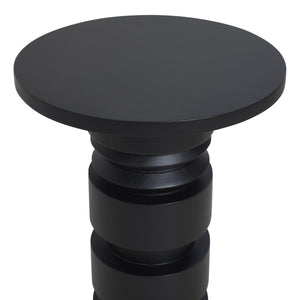 Talpa end table featuring a close-up view of its round black top and textured base.