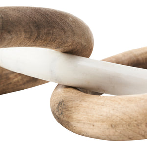 Close-up of Lusine Decorative Object with wooden and white marble rings intertwined.