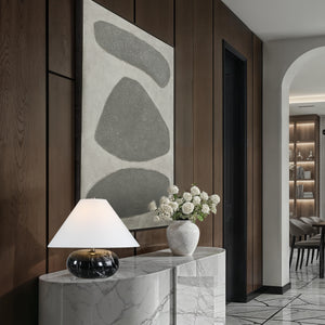 Celine Table Lamp on a marble console with a decorative vase and wall art