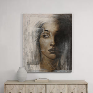 Cassandra Canvas Art displayed on a wall above a wooden console with decorative items.