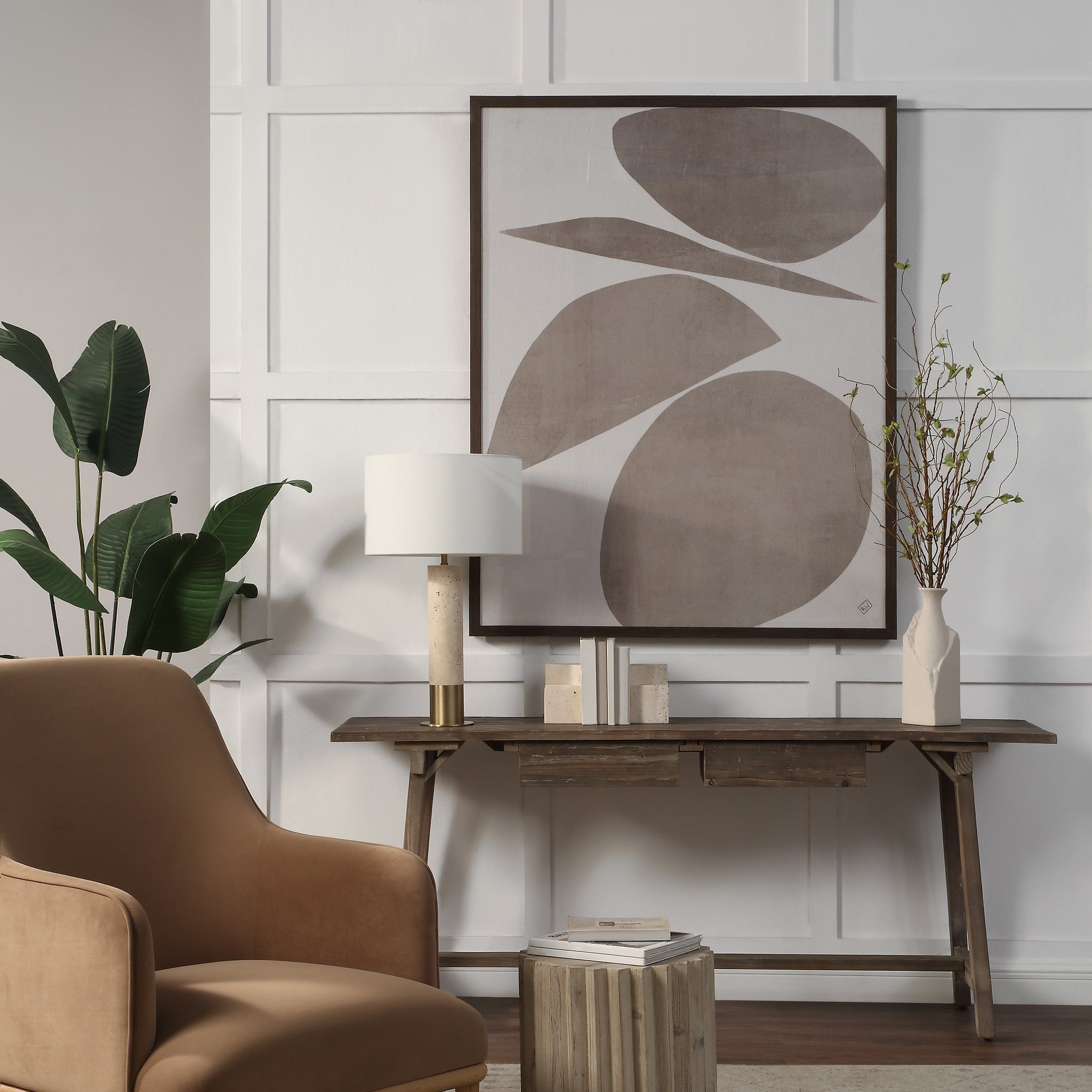 Belem wall art displayed in a modern living room setting with a brown chair and decorative elements.