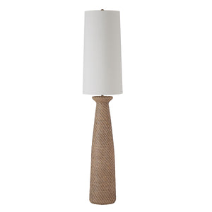 Nathalie floor lamp with a woven base and white cylindrical shade, showcasing a modern design.