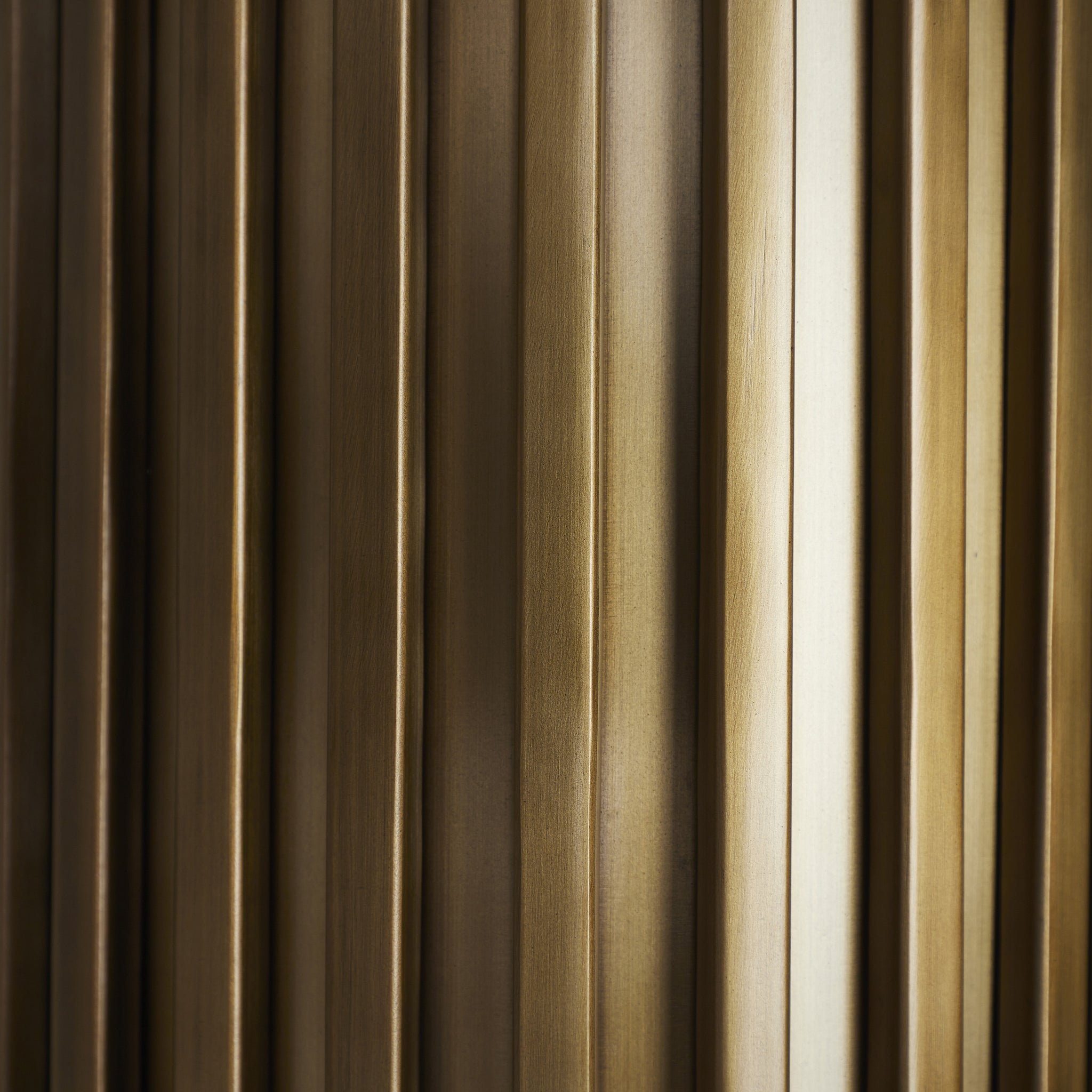 Detailed view of the ribbed design on the Fenice Flush Mount light in bronze.