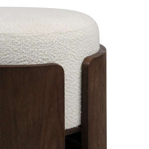 Close-up of Capsula Ottoman showing cream textured top and dark wood edges