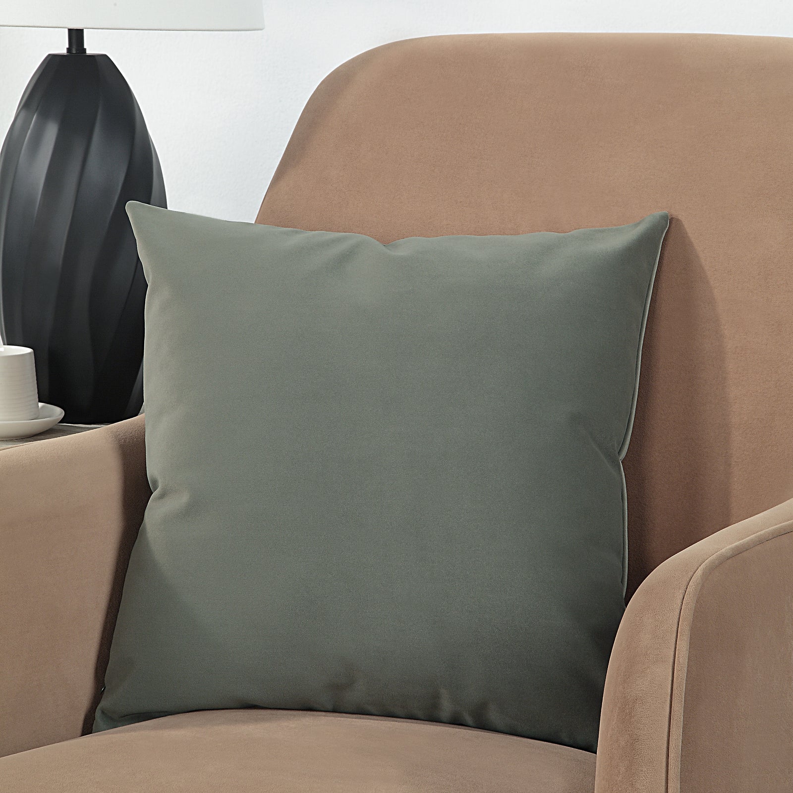 Philemon indoor pillow in dark green, soft fabric, square shape, front view.