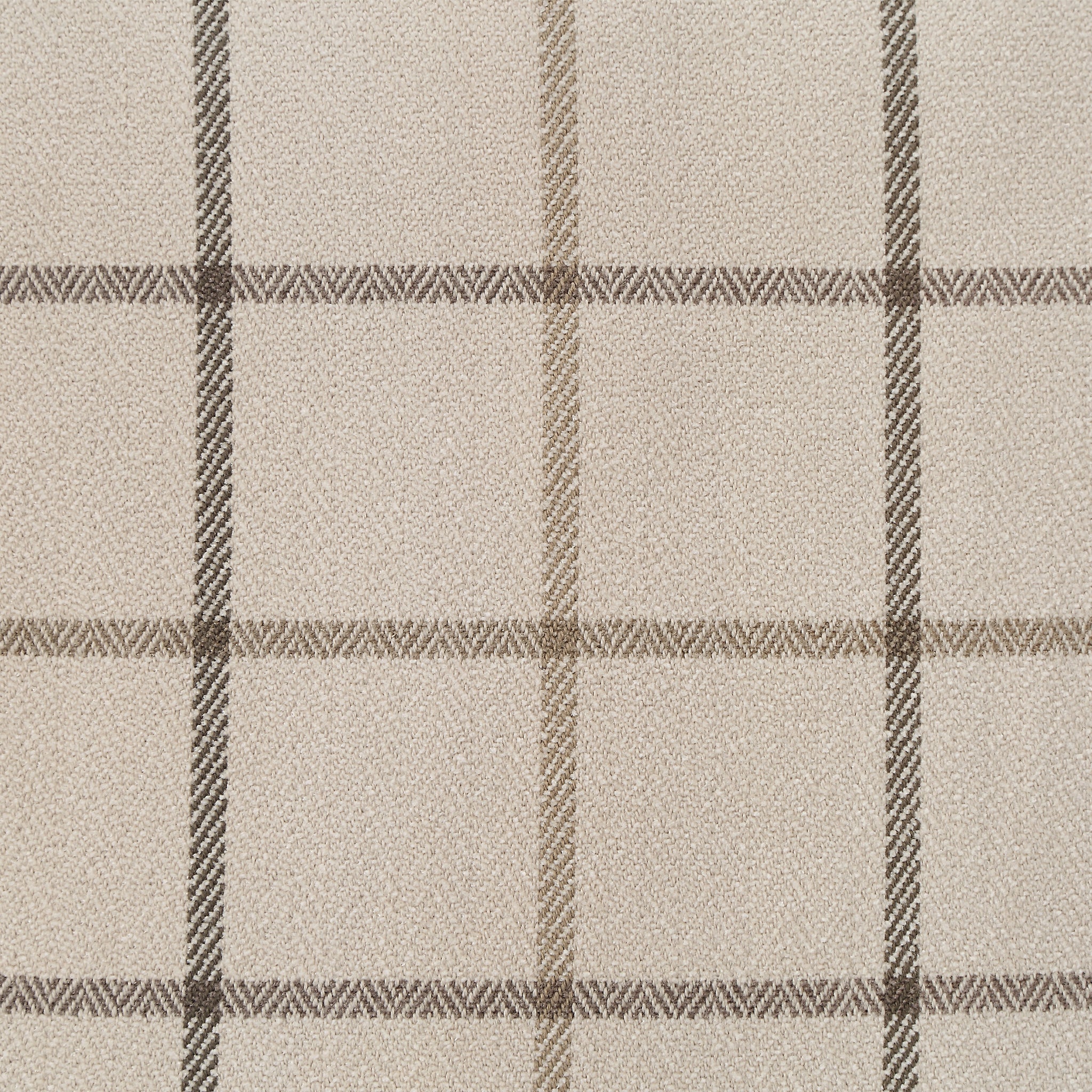 Close-up of Thornhill pillow fabric showing beige and brown plaid design.
