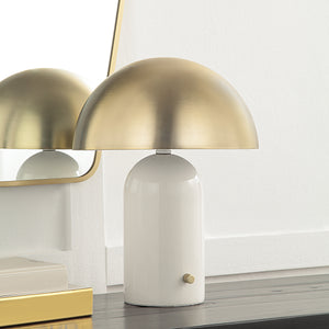 Solero Table Lamp on a wooden surface, reflecting in a mirror