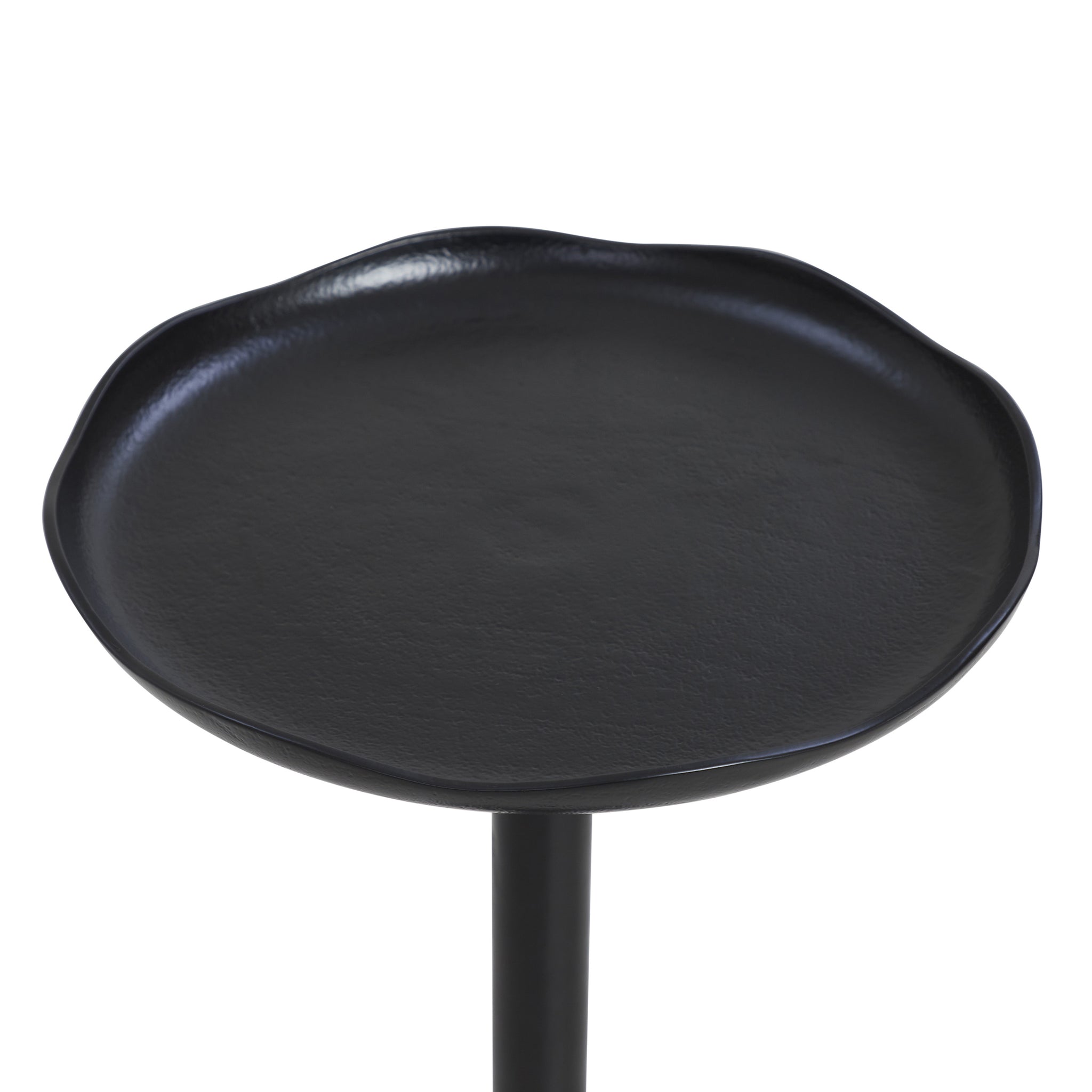 Fiora black side table with a textured round top and a sleek, minimalistic design.