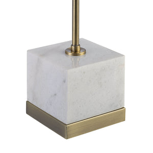 Volos Table Lamp with a square white marble base and a brass stem, viewed from an angle.