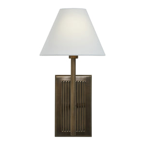 Solaria wall sconce illuminated, showcasing a white shade and bronze base with ribbed detailing.