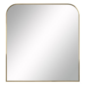 Joan Wall Mirror with rounded top, gold metal frame, and reflective surface.
