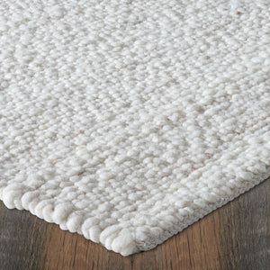 Detailed view of Meghan rug's plush surface, highlighting its light beige color and texture.