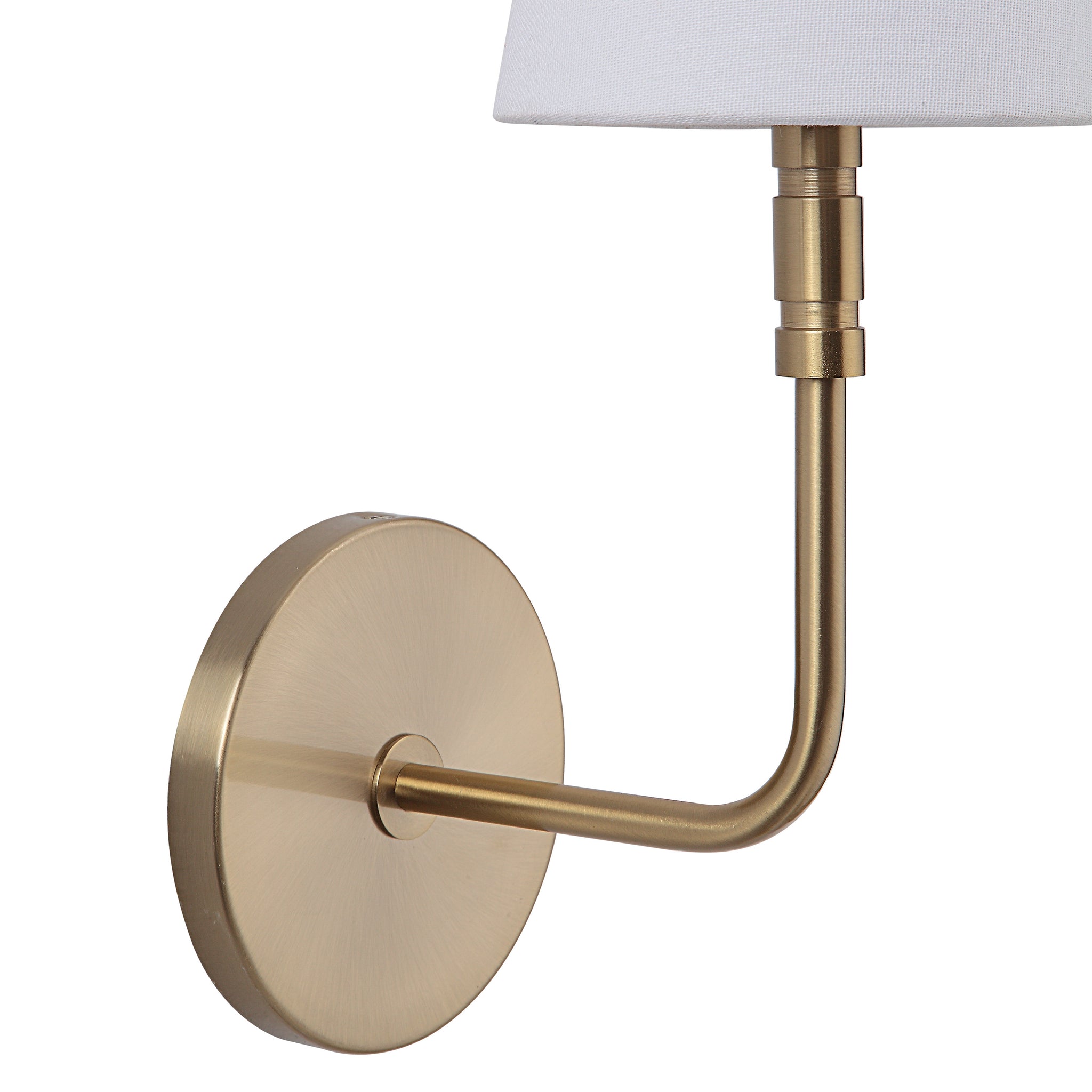 Close-up of Milia Wall Sconce showing gold metal arm and round base with white shade.