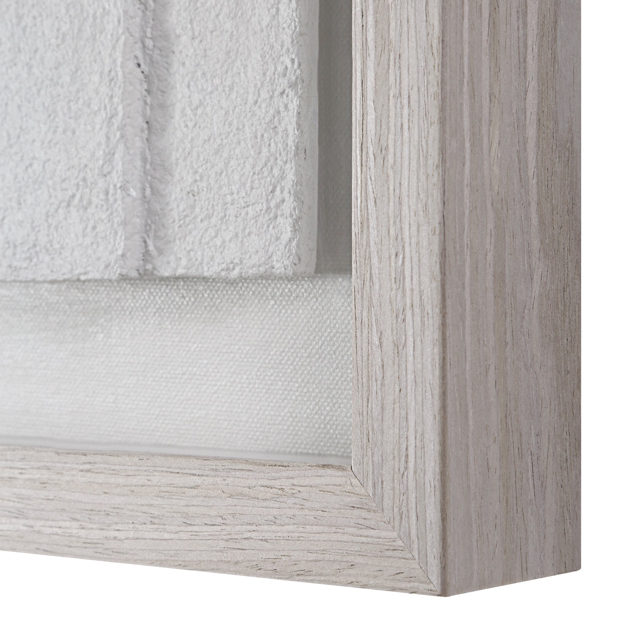 Close-up of Arches wall art frame showcasing textured white artwork