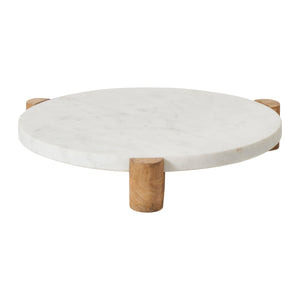 Lance round marble tray with four wooden legs, white marble surface, side view.