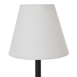Close-up of Kurosu wall sconce's white fabric shade with a textured finish