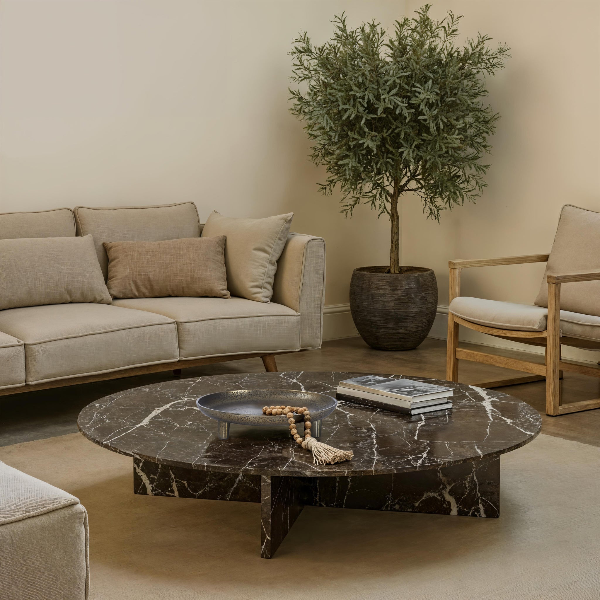 Kaleido Indoor Cast Aluminum Tray on a marble coffee table in a modern living room setting