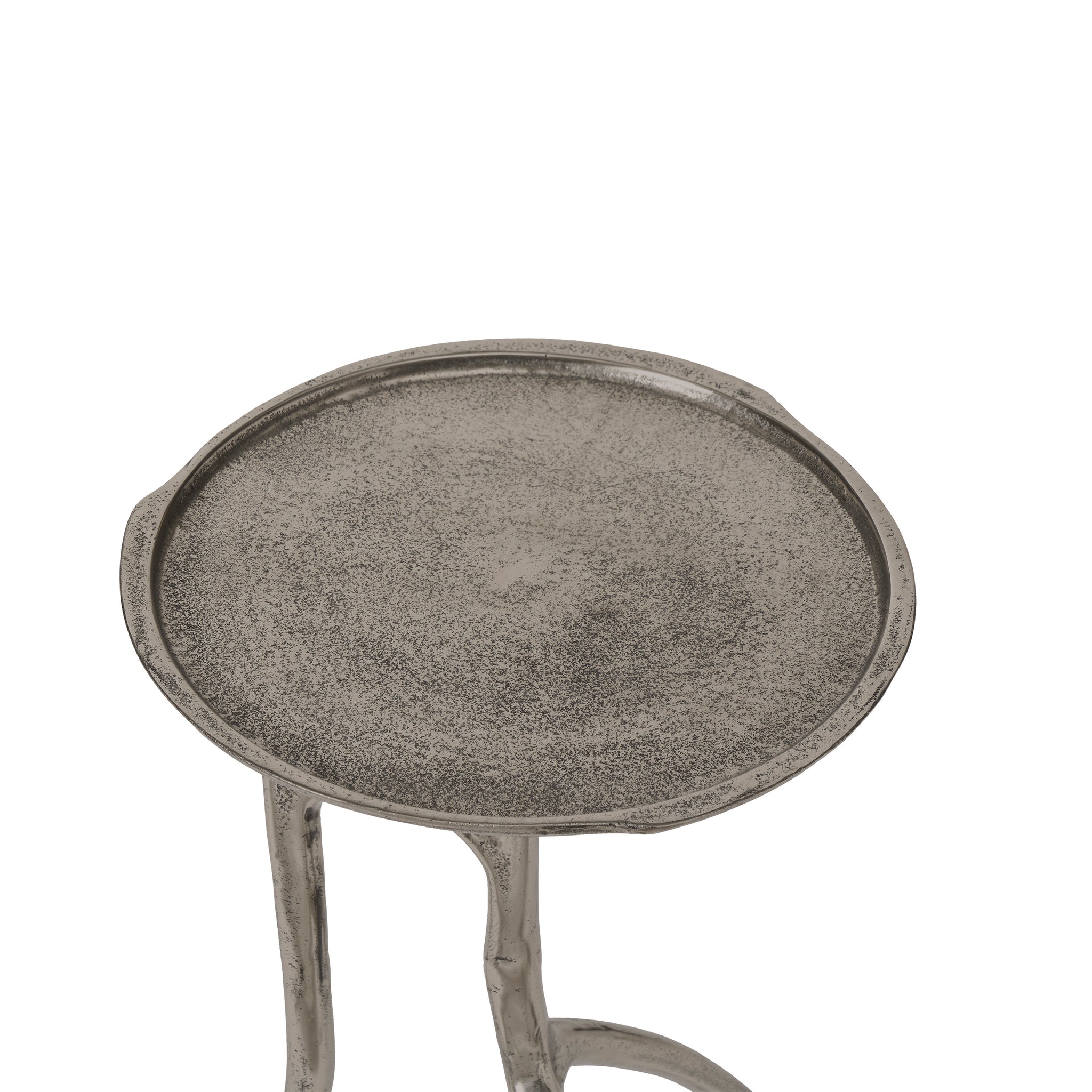 Top view of Tosco table showcasing its round metallic surface and unique legs.