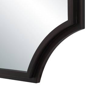 Close-up of Torre mirror by Renwil, highlighting the dark frame's scalloped edge detail.