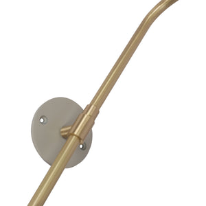 Close-up of Browne Wall Sconce's gold arm and round wall mount in matte gray, showcasing its sleek design.