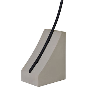 Close-up of Weymouth Floor Lamp's concrete base with a black arm