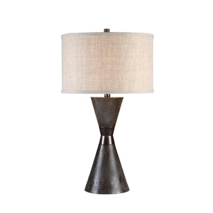Vyara table lamp featuring a dark textured base and light beige shade